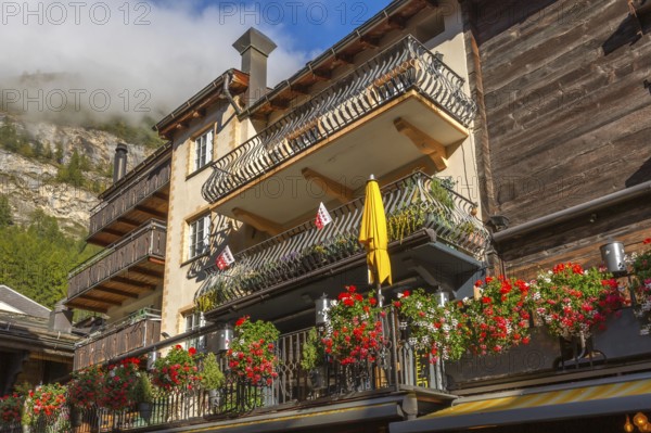 House decorated with flowers in Zermatt, alpine village, Switzerland, Swiss Alps, Europe