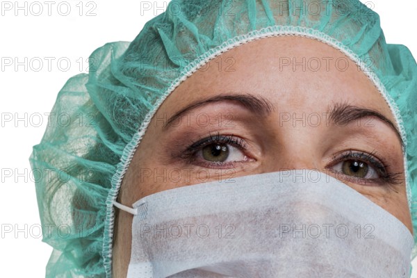 A nurse or doctor in surgical clothing in front of an operation. Symbolic photo for stress and overtime in hospital. Austria