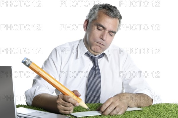 Businessman senior sign bank check funny humor gesture big pencil on green grass