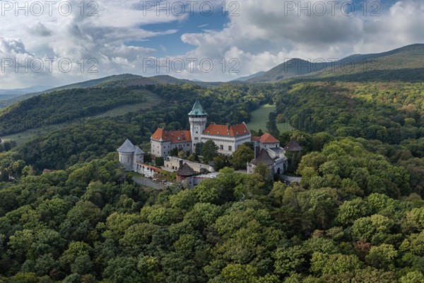 Smolenice, Slovakia, 26 September, 2022: view of Smolenice Castle in the Little Carpathians in green late summer forest, Europe