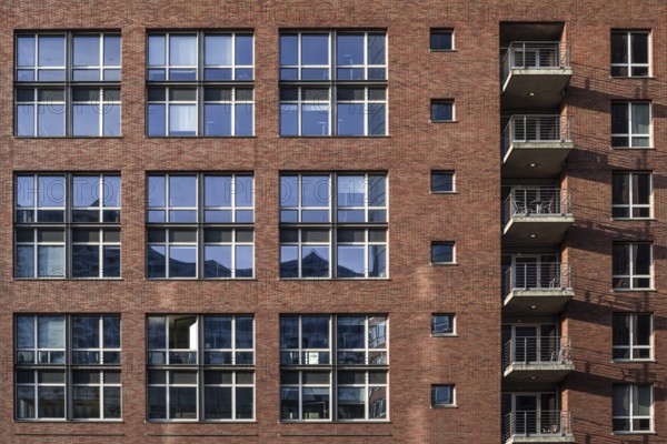 House facade in hamburg's Speicherstadt - reflection in the windows of the elbphilharmonie concert hall