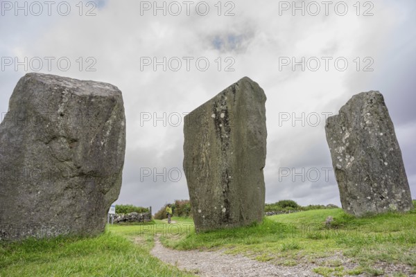 Woman observing the menhirs, Megalithic Circle of Drombeg, The Altar of the Druid-, Rosscarbery approximately from the year 150 a. c., Ireland, United Kingdom, Europe