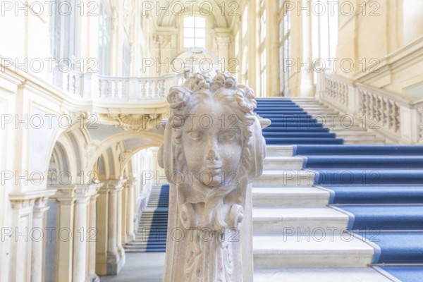 TURIN, ITALY, CIRCA JUNE 2021: The most beautiful Baroque staircase of Europe located in Madama Palace (Palazzo Madama) . Interior with luxury marbles, windows and corridors