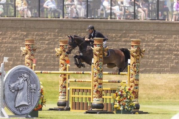 Kyle King of the United States and riding Odysseus, compete in the 1.60m Grand Prix during The Continental international competition at Spruce Meadows, in Calgary, Canada, North America