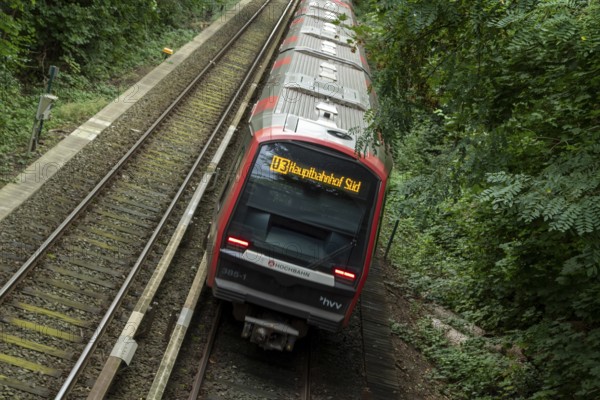 Metro, Hamburger Verkehrsverbund HVV, local transport, traffic turnaround, railway line in the countryside with a train travelling in the direction of central railway station Süd on the U3 underground line at the Sierichstraße stop in Winterhude, Hamburg, Germany, Europe