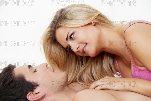A young couple has fun and pleasure in bed Austria