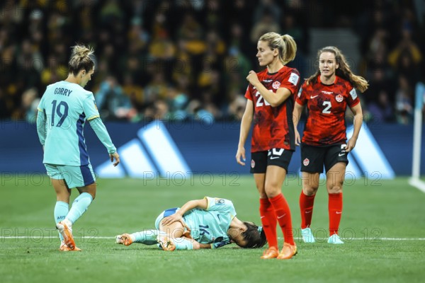 MELBOURNE, AUSTRALIA, JULY 31: Hayley RASO of Australia goes down injured as Australia plays Canada at the FIFA Women's World Cup Australia New Zealand 2023 at Melbourne Rectangular Stadium on July 31, 2023