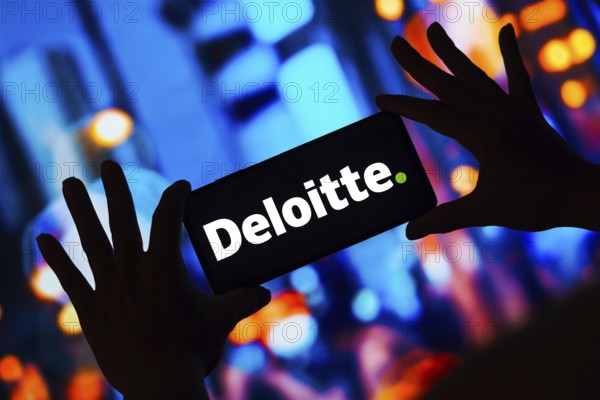 In this photo illustration, the Deloitte Touche Tohmatsu Limited logo is displayed on a smartphone screen