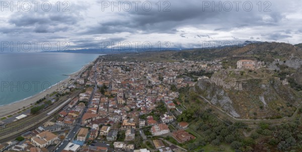 Roccella Ionica, Italy, 15 December, 2023: drone perspective of the picturesque Calabrian village of Roccella Ionica, Europe