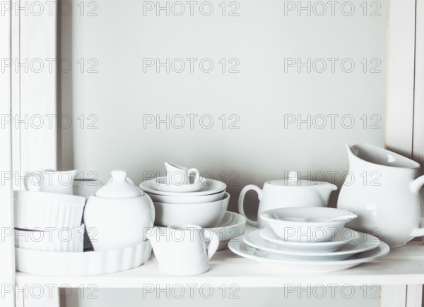 Shelves in the rack in the kitchen at shabby chic style