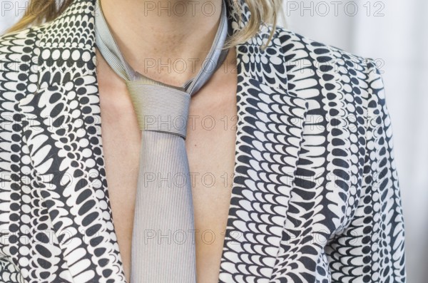 Great concept of women's rights, gender equality, gender, young blond and caucasian woman with tie