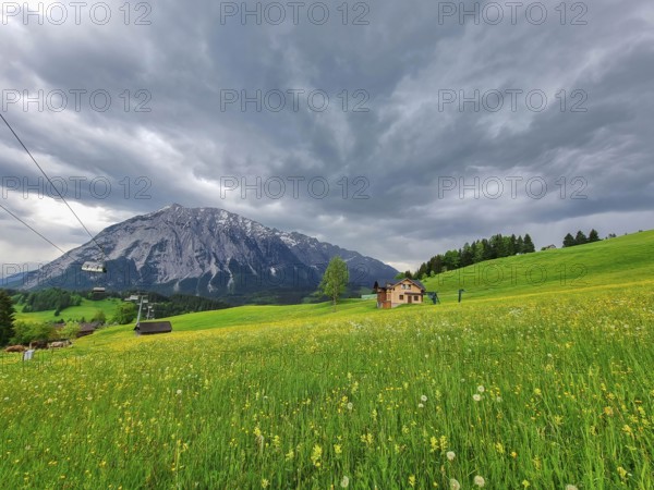 Summer austrian landscape with Grimming mountain (2.351 m), an isolated peak in the Dachstein Mountains, view from small alpine village Tauplitz, Styria, Austria, Europe