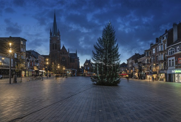 Jette, Brussels Capital Region, Belgium, 11 2 2019 The local market square, Place Miroir with a colorful sunset during the christmas holidays, Europe