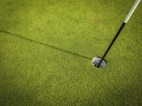 Detail Of A Hole On A Golf Course With Pole And Copy Space