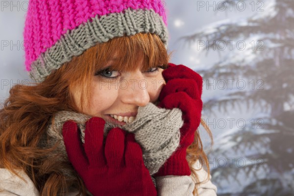 Portrait of woman in winter with snow