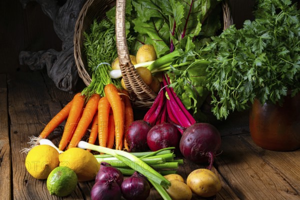 Basket with various vegetables: beetroot and carrots