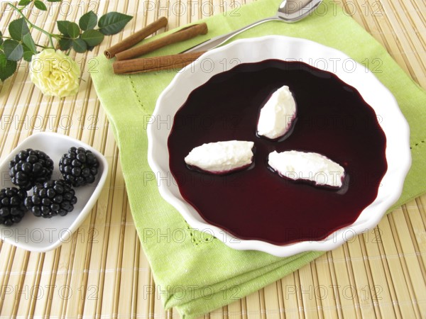 Sweet blackberry soup with quark dumplings