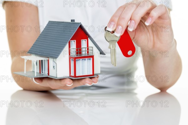 A real estate agent for properties with a house and a key Successful letting and house sales by real estate agents. Austria