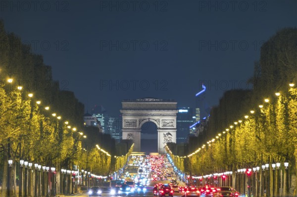 Paris France night city skyline at Arc de Triomphe and Champs Elysees