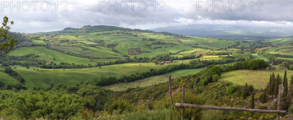 Tuscany panorama landscape with farmland hill fields in Italy