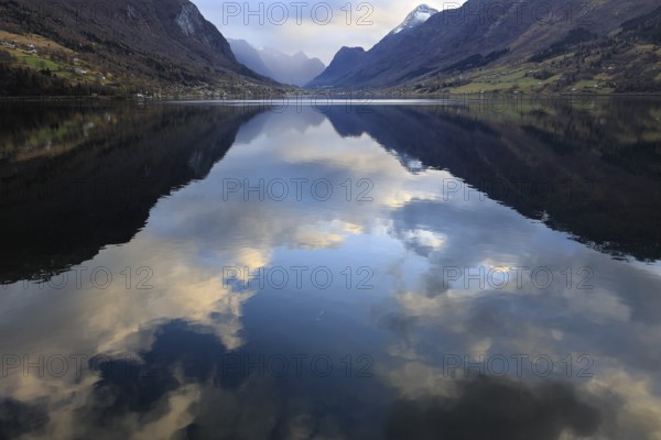 View of the Innvikfjorden near Loen in Norway. The landscape is reflected in the water