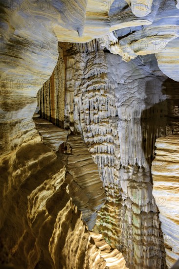 Interior of a deep cave with its columns and rock formations in Lagoa Santa in the state of Minas Gerais, Brazil, South America