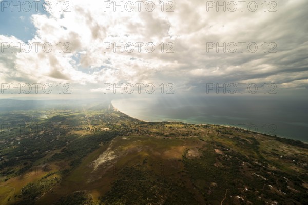 Clouds, sunbeams breaking through clouds, road, swamp landscape, forest, village Mphosa, Lake Malawi, near Mlenga Senga, Fumbawowa, Northern Region, Malawi, Africa