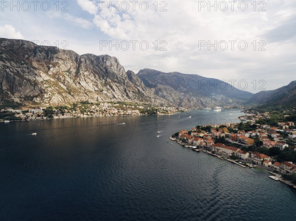 Kotor Bay, photo from a drone, near the city of Prchan. View of the town Dobrota and Kotor, and the rocky mountains above them.