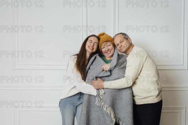 Close up portrait of family with elderly mature woman, man and millennial daughter.