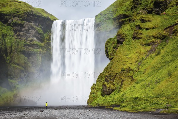 Magnificent famous waterfall Skógafoss, Iceland. A powerful jet Skógar River forms a large rainbow