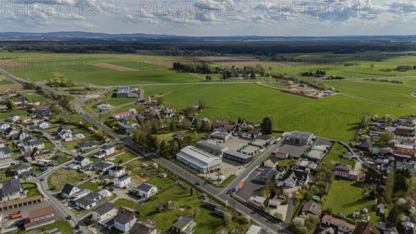 Aerial view of a village with houses, streets and fields under a slightly cloudy sky, Mitterteich, Upper Palatinate, Bavaria, Germany, Europe