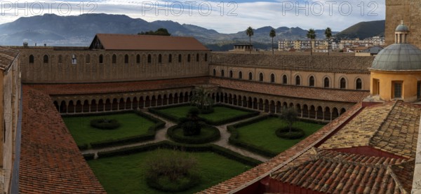 Monreale, Italy, 5 January, 2024: panorama view of the cloister and inner courtyard of the Monreale Cathedral in Sicily, Europe