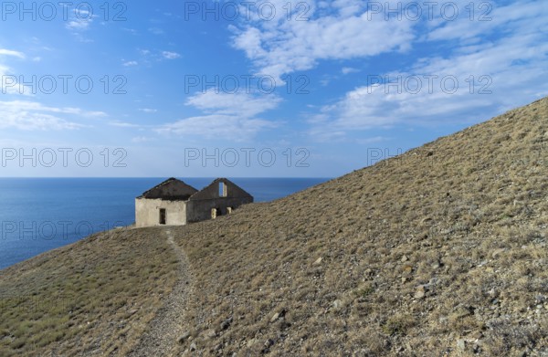 Old ruined house on the hillside above the sea. Crimea, Cape Meganom