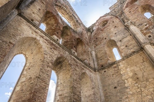 Spectacular ruins of a once-glorious cathedral in Italy. Beautiful view of The Abbey of Saint Galgano, an ancient Cistercian Monastery founded in the province of Siena, region of Tuscany