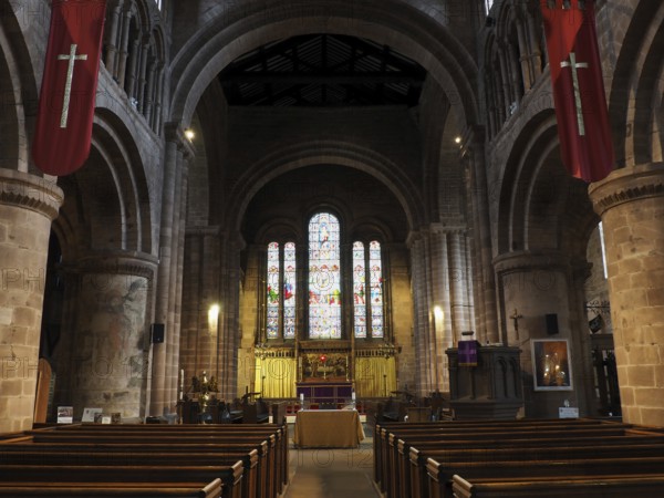 Chester. Cheshire, United Kingdom, 20 March 2024 : The nave, chancel and stained glass windows in St John the Baptist's Church, Chester, Europe