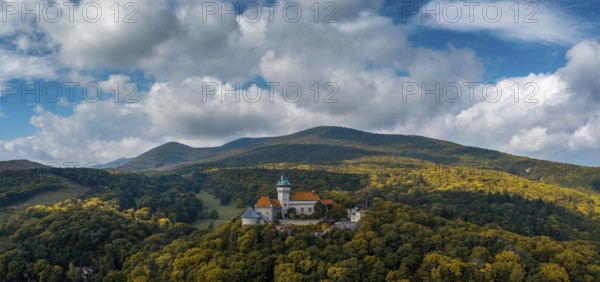Smolenice, Slovakia, 26 September, 2022: panorama landscape of Smolenice Castle in the Little Carpathians in early autumn with fall foliage colors, Europe