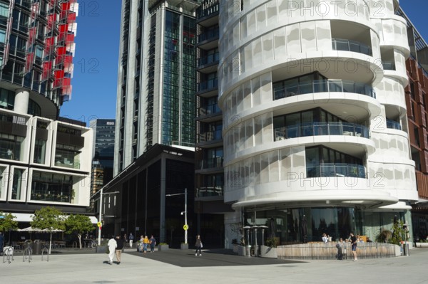 16 Sep 2018, Sydney, New South Wales, Australia, A view of modern residential buildings at Anadara Residence, office towers and restaurants along the pedestrianised Wulugul Walk in Barangaroo South. The buildings are located on the banks of Darling Harbour with the International Towers towering in the background, Oceania