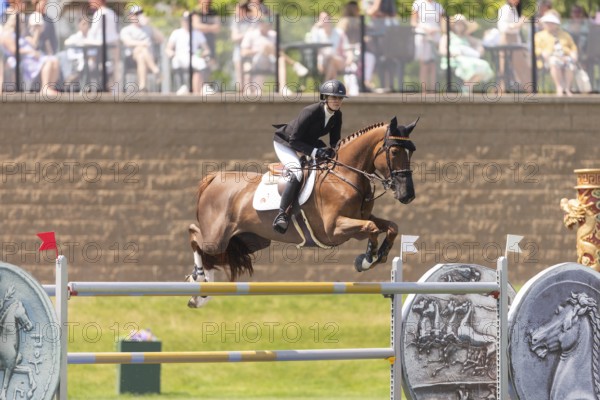 Tiffany Foster of Canada and riding Electrique, compete in the 1.60m Grand Prix during The Continental international competition at Spruce Meadows, in Calgary, Canada, North America