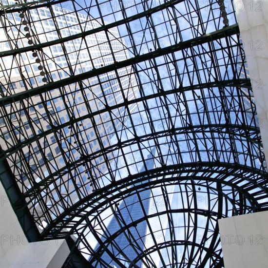 View of skyscrapers through the glass ceiling of the World Financial Centre in New York, NY, USA, North America
