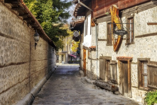 Bansko, Bulgaria, October 31, 2020: Autumn street view in downtown, old traditional bulgarian house, mehana Dedo Pene, Europe