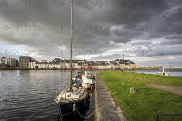 Boat anchored in Eglinton Canal Sea Lock, The Long Walk, Galway, Ireland, United Kingdom, Europe