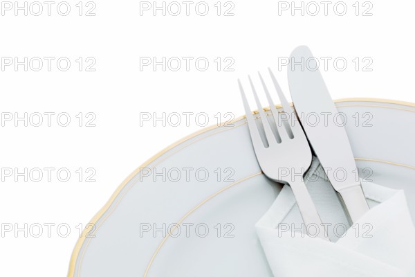 A knife with fork and plate. Place setting for a dinner in a restaurant. Austria