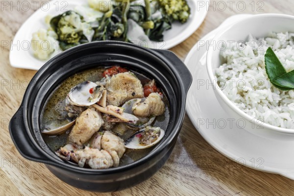 Traditional fish clams and mixed seafood portuguese spicy soup stew meal