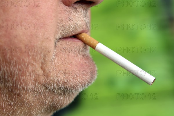 Man with a cigarette in his mouth