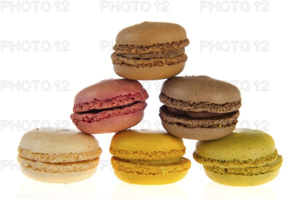 Colorful French macarons isolated over white background