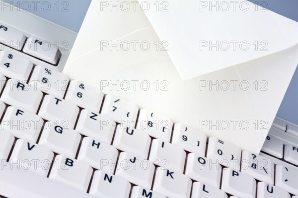 The keyboard of a computer and an envelope. Communication via e-mail, The keyboard of a computer and an envelope. Communication via e-mail. Austria