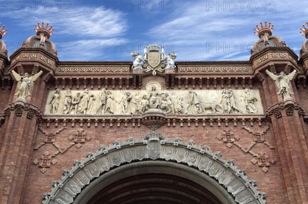 Arc de Triomphe Barcelona closeup against a blue sky with clouds