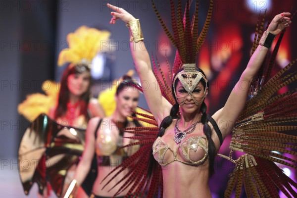 Sofia, Bulgaria - March 23, 2016: Sexy female performers are dancing at the runway at Sofia Fashion Week Show in colorful and exotic costumes