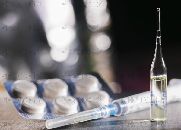 Pills, Syringe And Ampoule With Vaccination On Dark Table