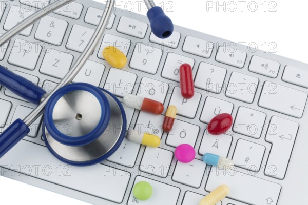 Tablets on keyboard, symbol photo for online pharmacies and drug costs Austria